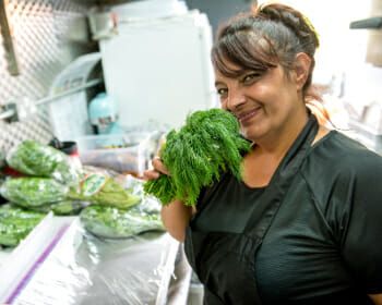 chef-smelling-fresh-herbs